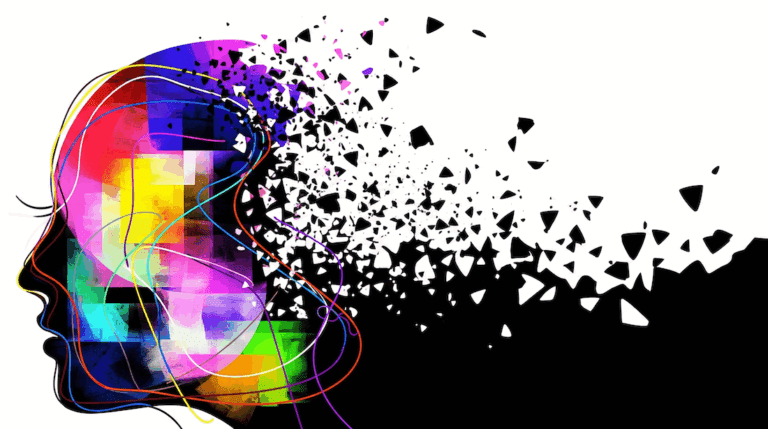 Déconstruire nos Projections et nos Attentes : La Voie vers un Bonheur Plus Authentique 9 Représentation abstraite d'une tête humaine aux couleurs vives se fragmentant en petits morceaux sur un fond blanc, symbolisant le lâcher-prise des projections et des attentes.